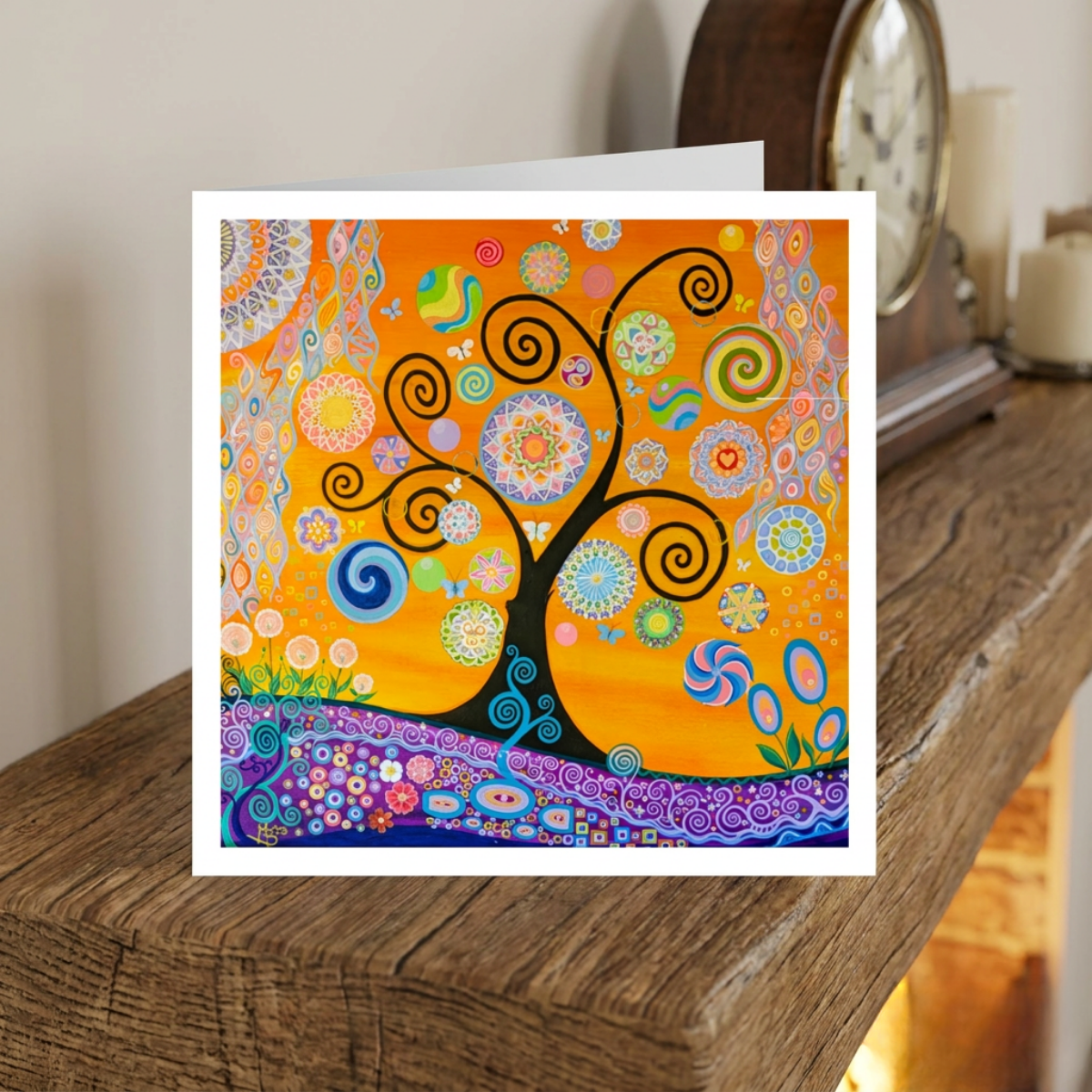 Colourful abstract card with a tree design on a wooden surface