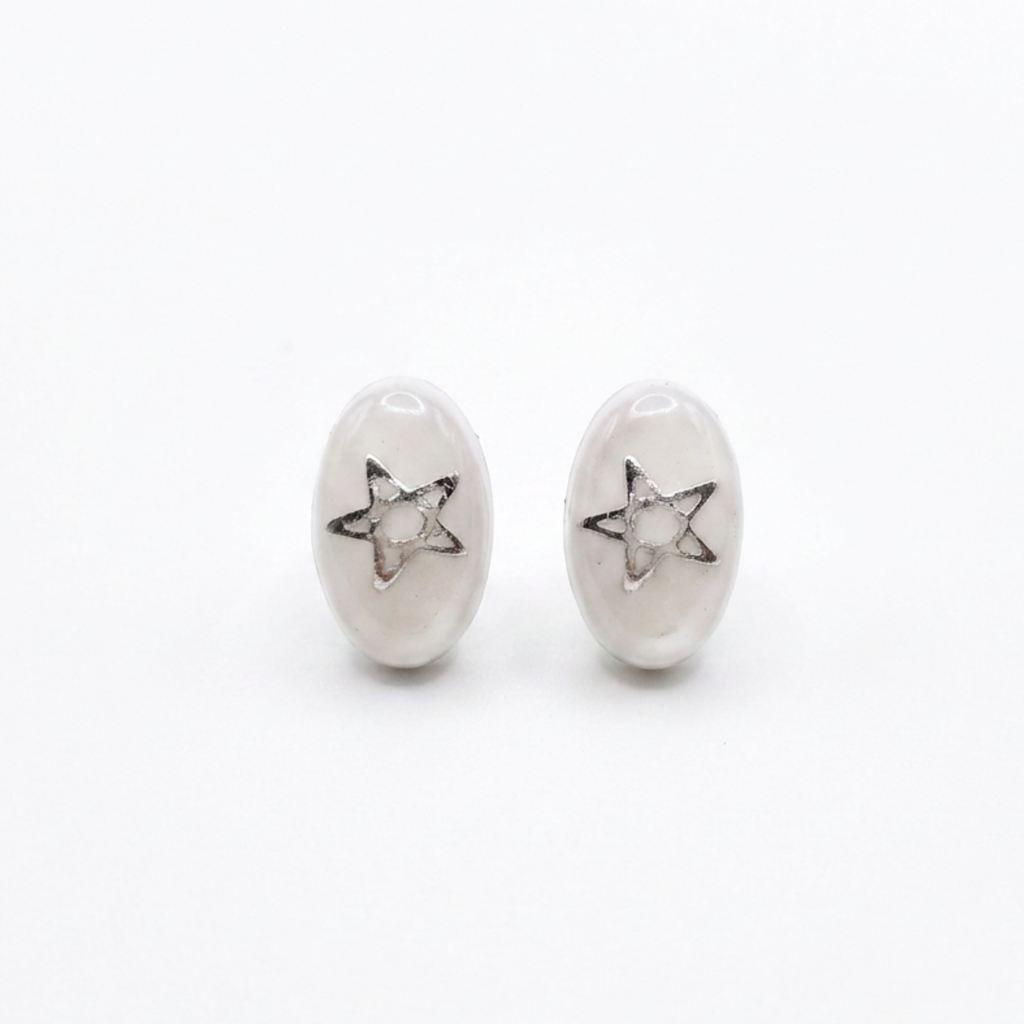 White and star stud earrings on a white background 