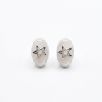 White and star stud earrings on a white background 