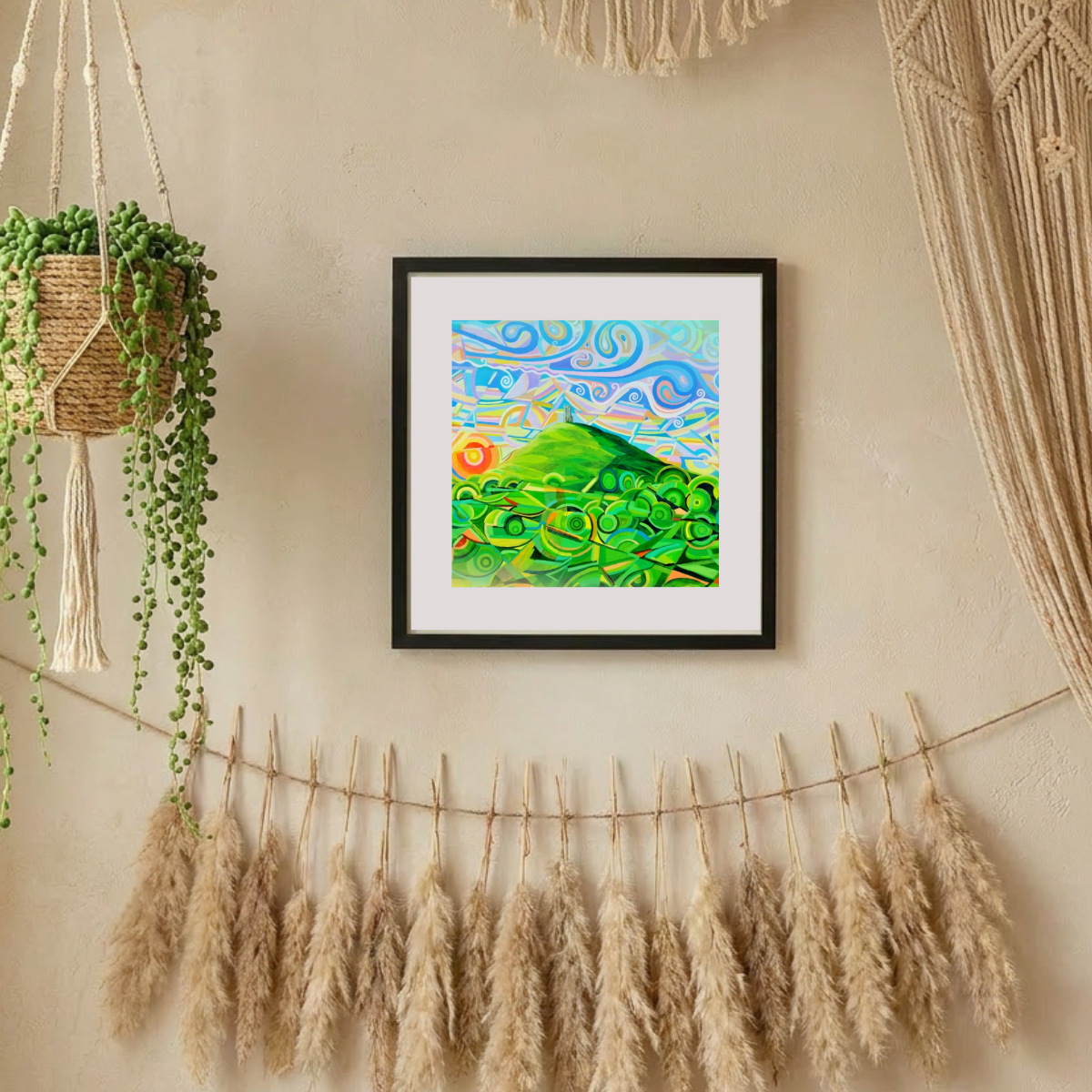 Framed abstract artwork on a wall with decorative elements
