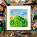 Colourful abstract painting on a wooden surface with art supplies
