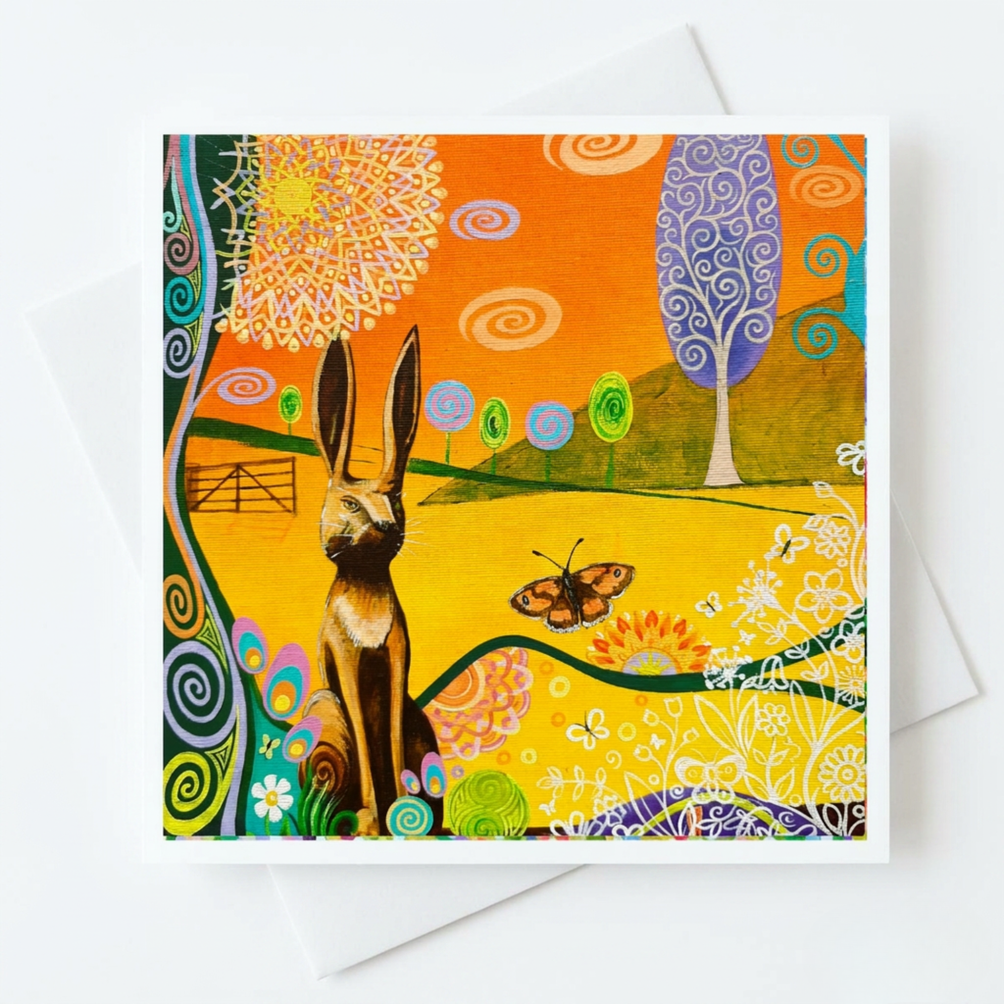 Colourful greeting card with a hare sculpture and butterfly design on a white background