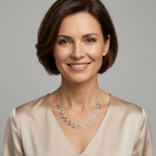 Elegant lady wearing a pink satin top and a Celtic silver spiral necklace with a chain