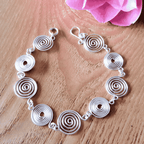 Open silver spiral bracelet worn by model, handmade jewellery, gift for her UK