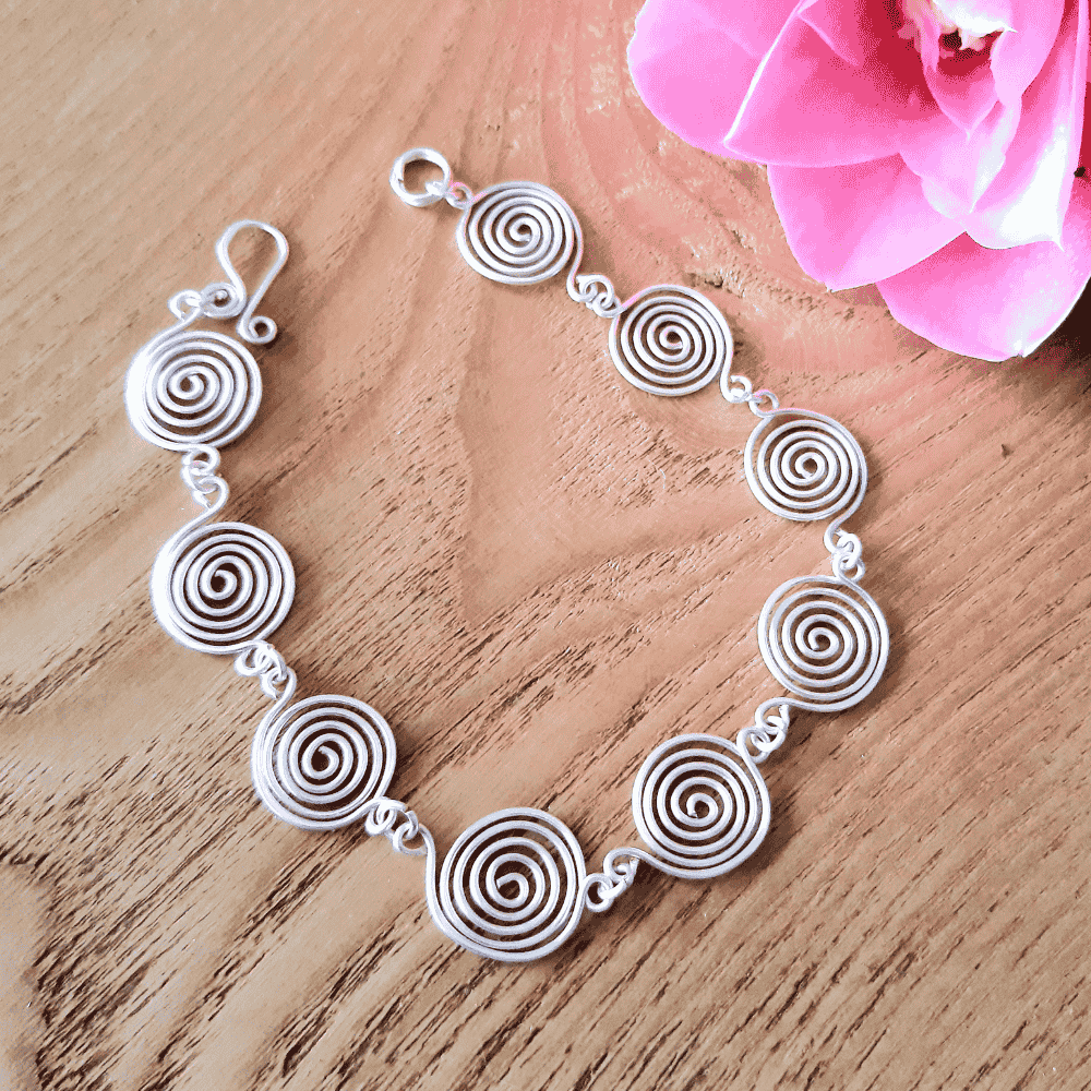 Open silver spiral bracelet worn by model, handmade jewellery, gift for her UK